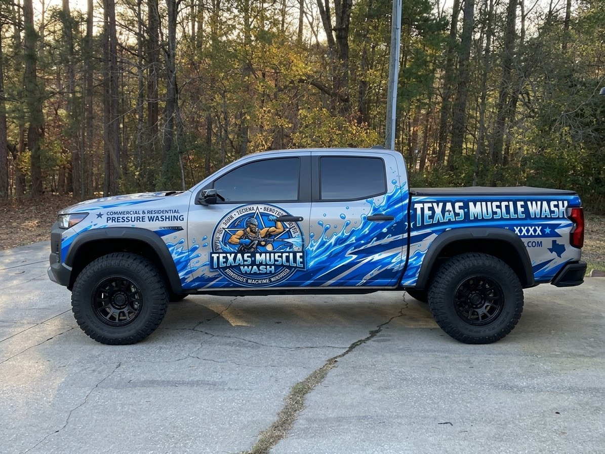 The Texas Muscle Wash work truck, wrapped in blue water splash graphics and ready for the next job